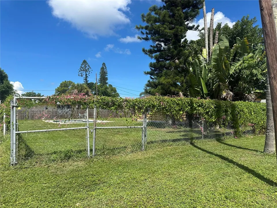 Existing property and fenced yard at 3928 S East Ave in Sarasota