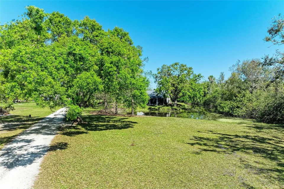 Acreage, driveway and pond at 4007 45th St E in Bradenton