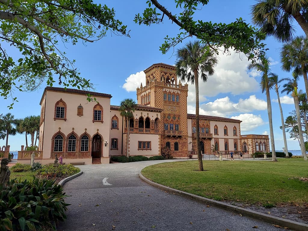 Ca’ d’Zan at The Ringling in Sarasota, framed by palms and a garden path